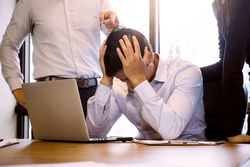 stock-photo-business-people-blaming-frustrated-male-colleague-in-office-negative-human-emotions-concept-695470876